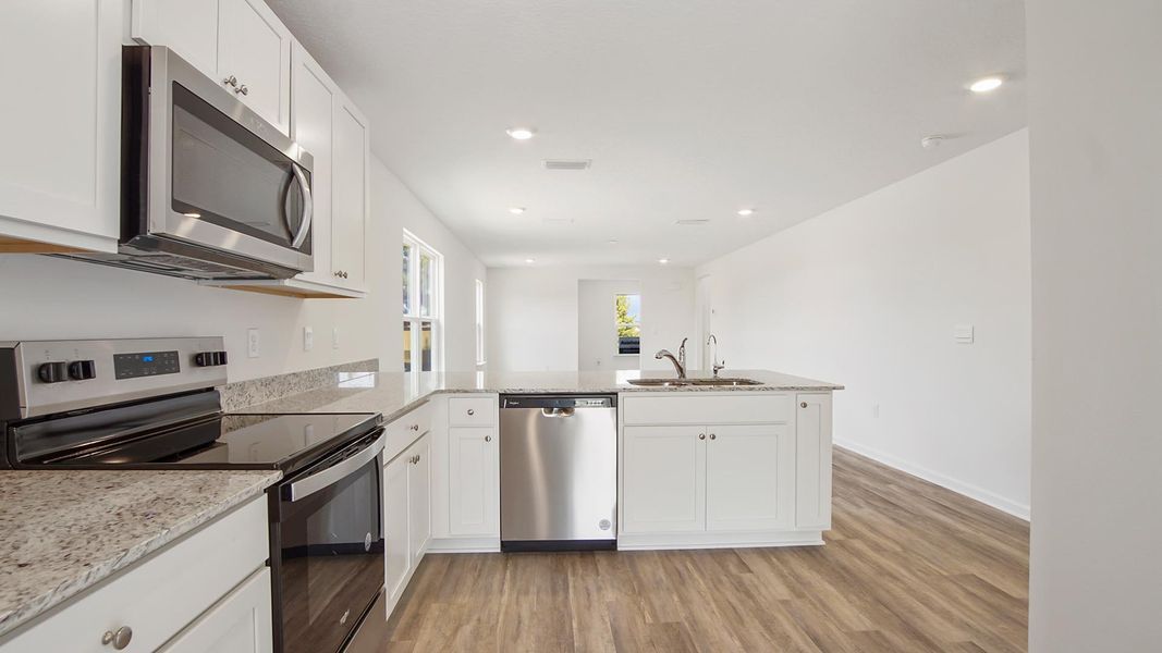 Furnished interior view inside a new home in Owl's Head East, Freeport (Image 7).