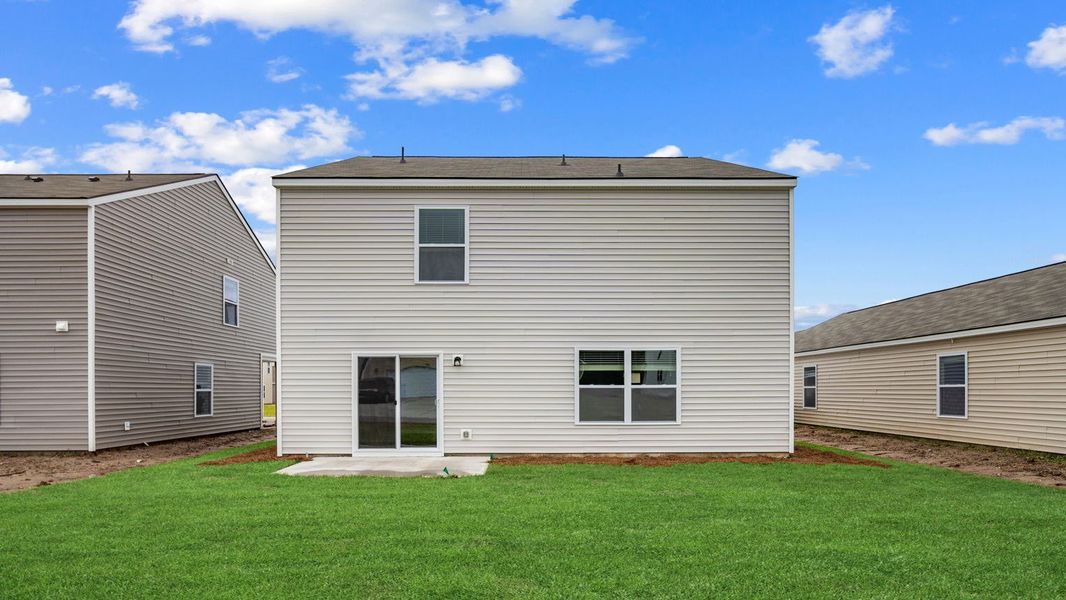 Front exterior of a new home in Rice Hope, Port Wentworth, GA, highlighting curb appeal (Image 25). Front exterior of a new home in Rice Hope, Port Wentworth, GA, highlighting curb appeal (Image 25).