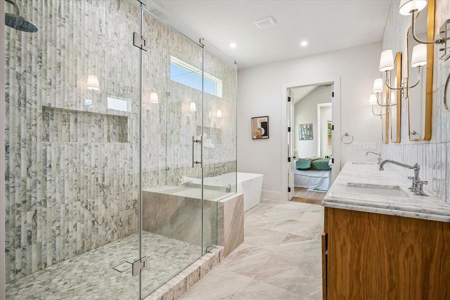 Primary bath, oversized frameless glass shower, Calacatta Giallo tile, freestanding soaking tub Primary bath, oversized frameless glass shower, Calacatta Giallo tile, freestanding soaking tub
