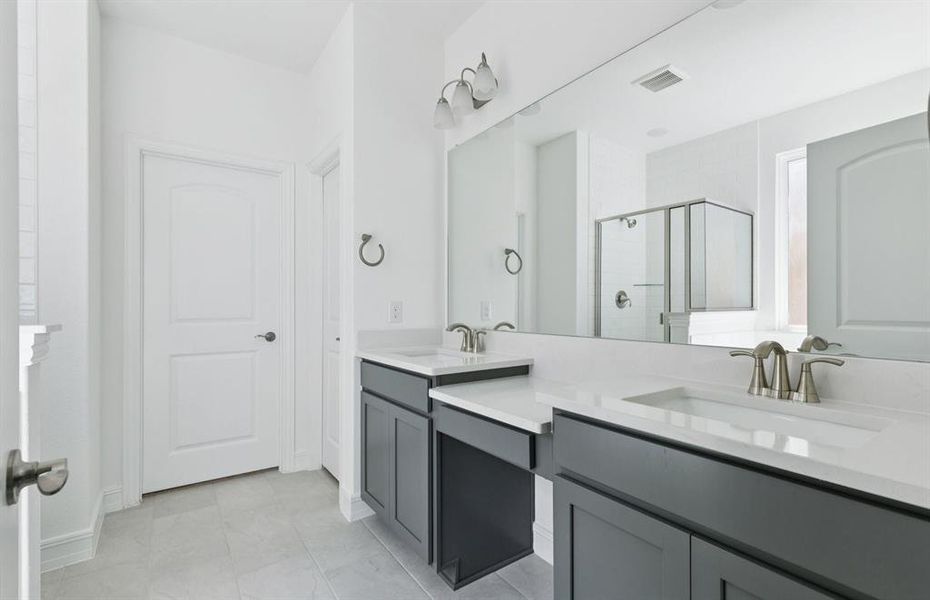 Double vanity in owner's bath