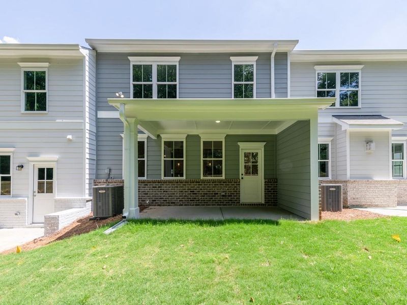 Front exterior of a new home in Wilkins Walk, Mableton, GA, highlighting curb appeal (Image 28). Front exterior of a new home in Wilkins Walk, Mableton, GA, highlighting curb appeal (Image 28).