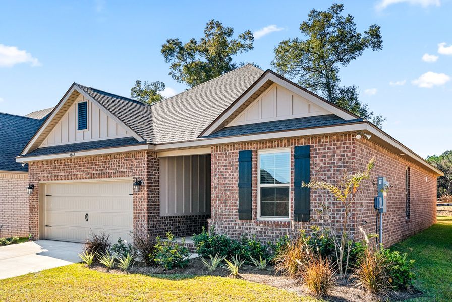 Front exterior of a new home in Sentinel Ridge, Pace, FL, highlighting curb appeal (Image 16).