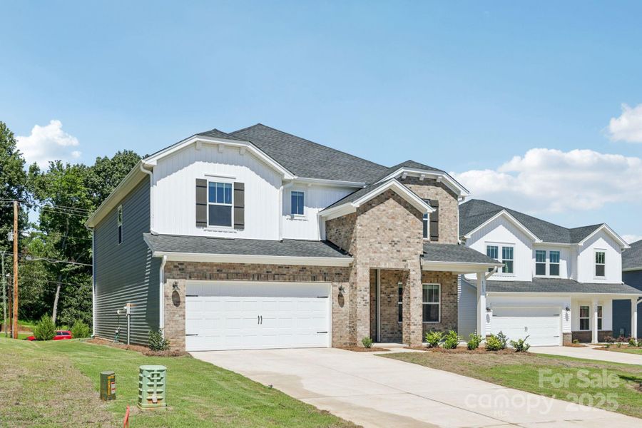 Front exterior of a new home in Nelson's Creek, Mocksville, NC, highlighting curb appeal (Image 2). Front exterior of a new home in Nelson's Creek, Mocksville, NC, highlighting curb appeal (Image 2).