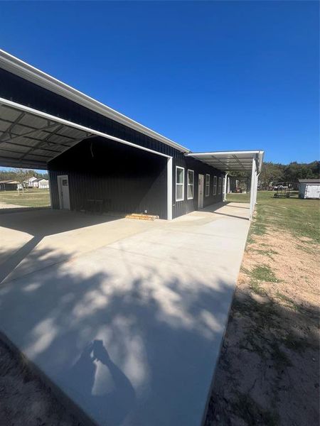 View of side of property with an attached carport View of side of property with an attached carport