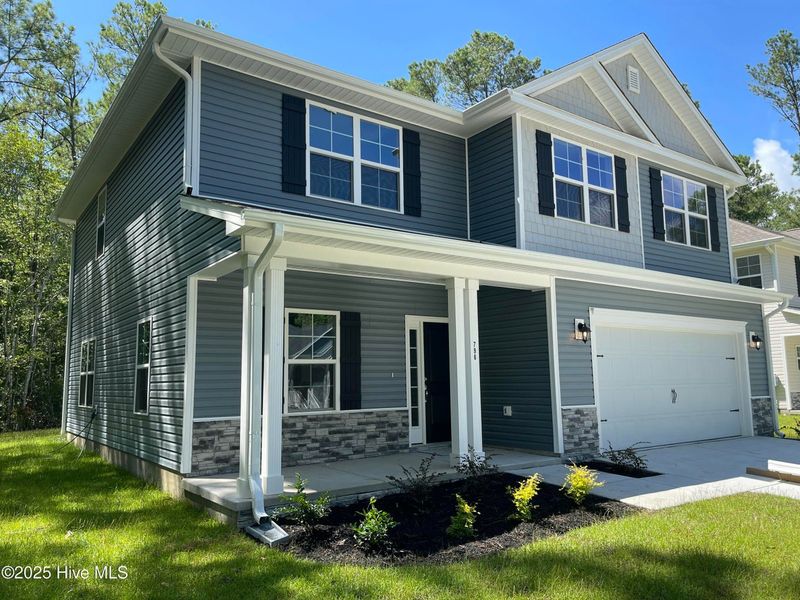 Front exterior of a new home in Mill Creek Cove, Bolivia, NC, highlighting curb appeal (Image 12).