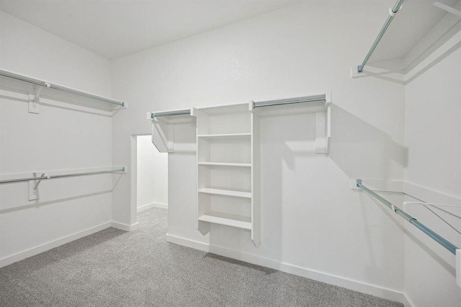 Primary Closet in the Wimbledon home plan by Trophy Signature Homes – REPRESENTATIVE PHOTO Primary Closet in the Wimbledon home plan by Trophy Signature Homes – REPRESENTATIVE PHOTO