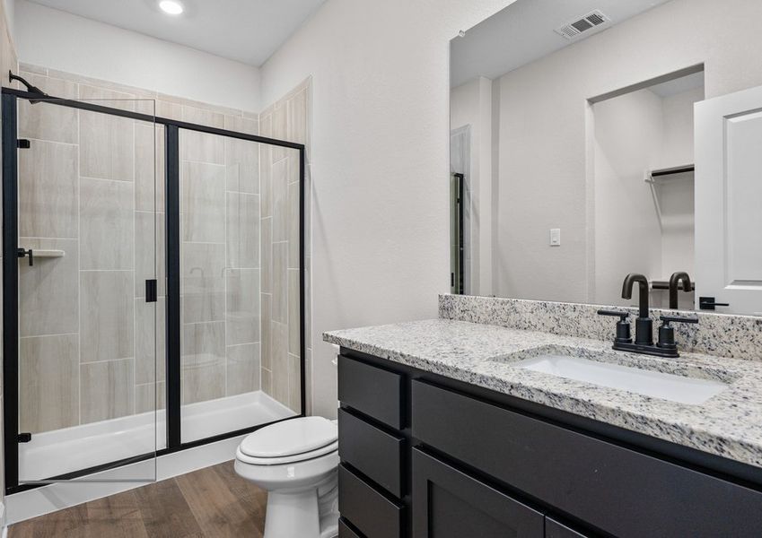 The master bathroom has a sprawling vanity and walk-in, glass shower. The master bathroom has a sprawling vanity and walk-in, glass shower.