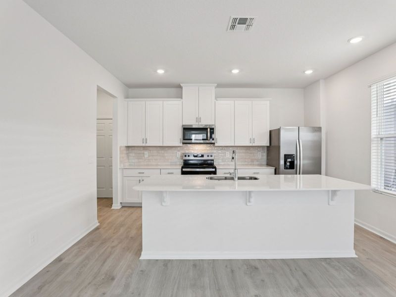 Furnished interior view inside a new home in The Meadow at Crossprairie Bungalows, St. Cloud (Image 3).