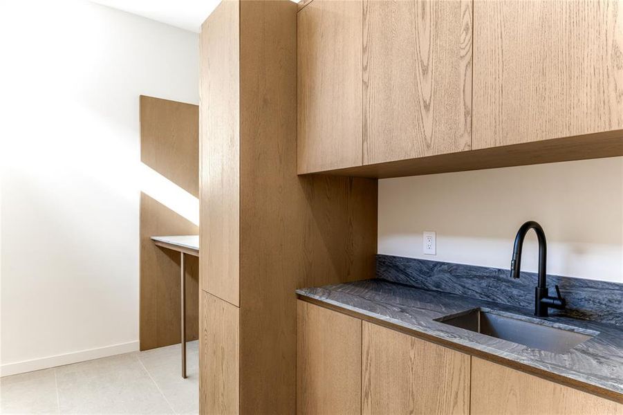 Close up of counter and sink in gameroom.