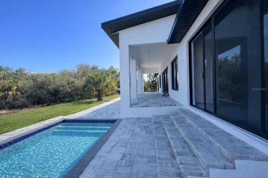 Exterior details and patio area of a home in , Port Charlotte (Image 16).