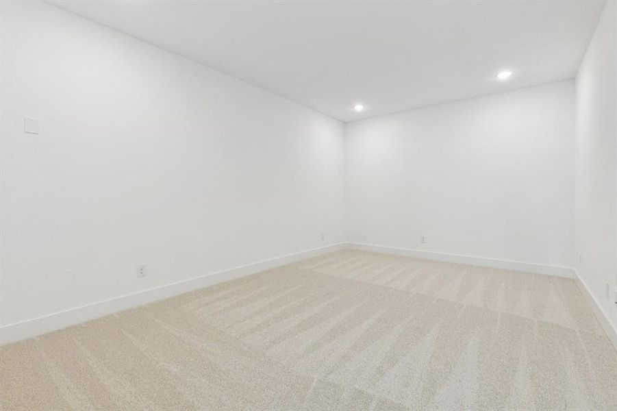 The spacious media room with adjacent game room create the ultimate family entertainment area!