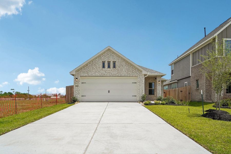 Front exterior of a new home in Aldeana, Bonney, TX, highlighting curb appeal (Image 2). Front exterior of a new home in Aldeana, Bonney, TX, highlighting curb appeal (Image 2).