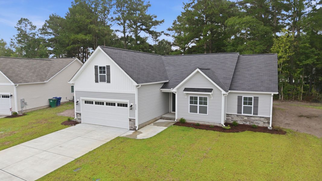 Front exterior of a new home in Davenport Farms, Winterville, NC, highlighting curb appeal (Image 23). Front exterior of a new home in Davenport Farms, Winterville, NC, highlighting curb appeal (Image 23).
