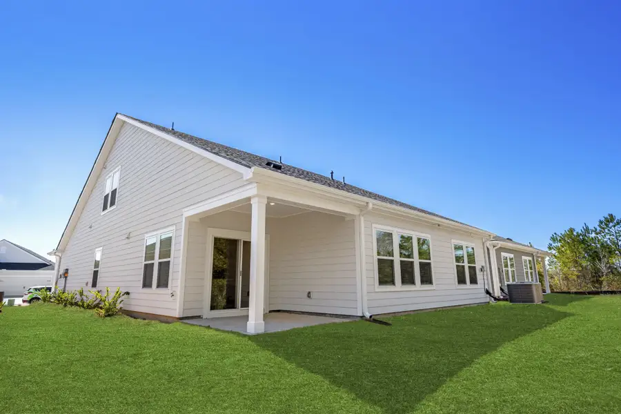 Exterior details and patio area of a home in Waterside - Coastline Series, Longs (Image 2).