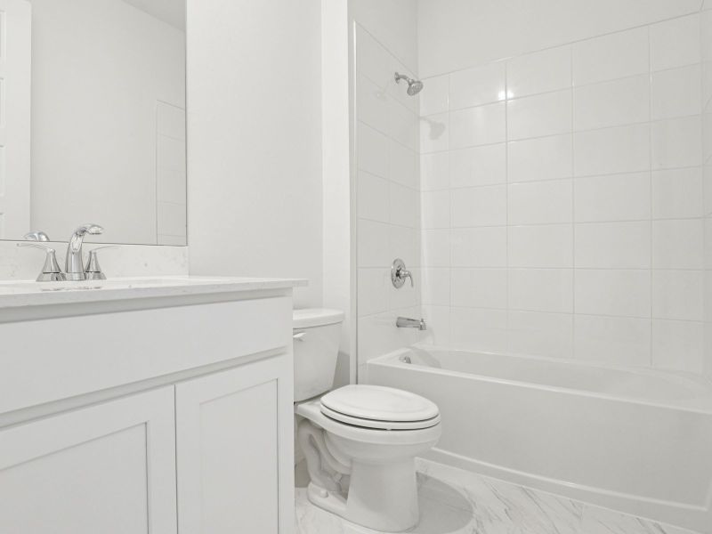 Furnished interior view inside a new home in Crescent Lakes - Signature Series, Punta Gorda (Image 9).