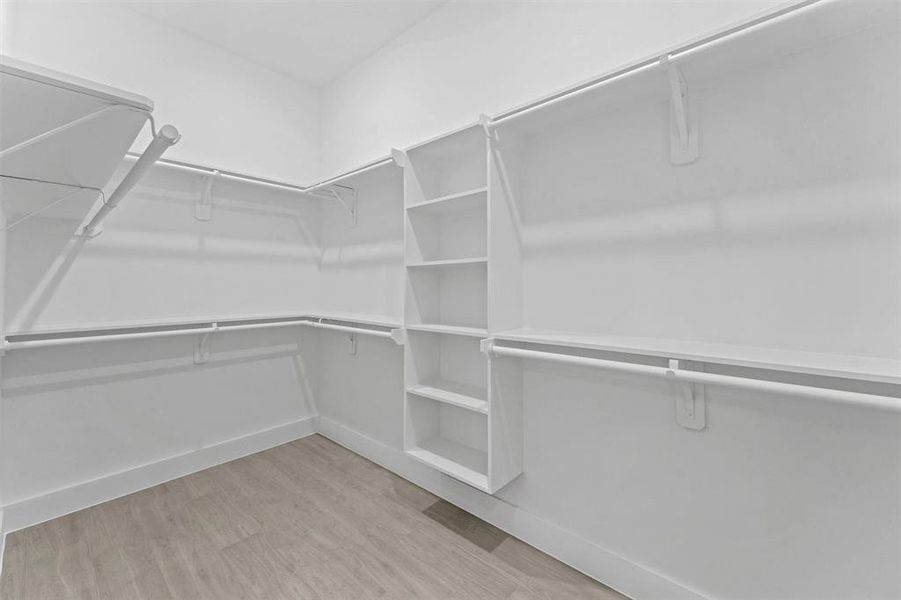 Primary walk-in closet.