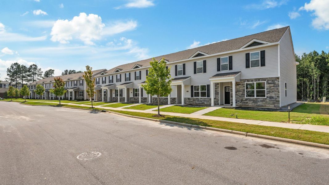 Front exterior of a new home in Clock Road Townhomes, New Bern, NC, highlighting curb appeal (Image 2).