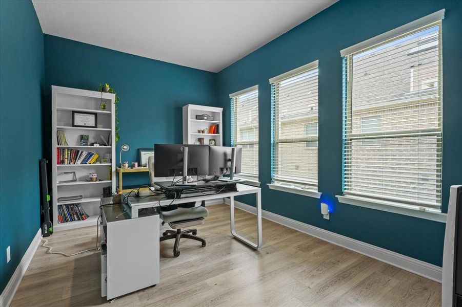 Office space with light wood-type flooring