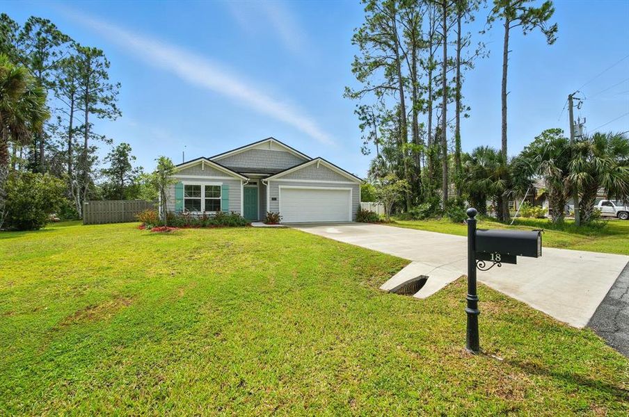 Front exterior of a new home in Palm Coast Homesites, Palm Coast, FL, highlighting curb appeal (Image 21).