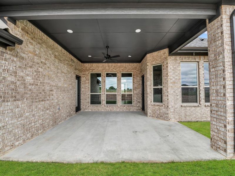 View of patio featuring ceiling fan