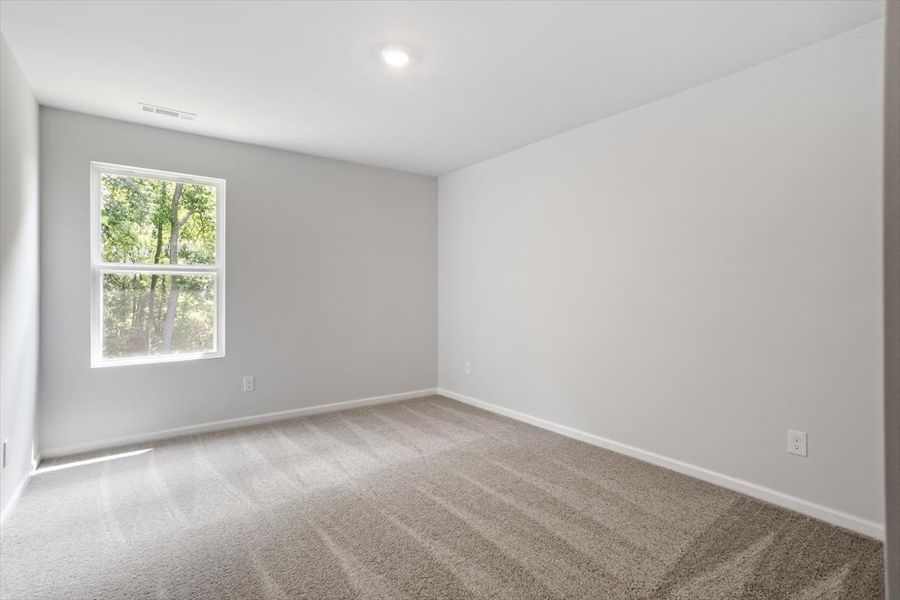 Spacious, unfurnished interior of a new home in Cambridge Reserve, Angier (Image 32).