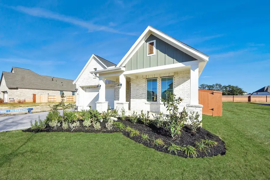 Front exterior of a new home in Elyson, Katy, TX, highlighting curb appeal (Image 25).