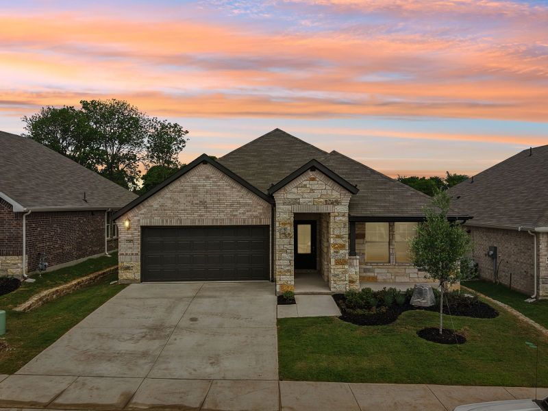 Front exterior of a new home in Westmoor, Sherman, TX, highlighting curb appeal (Image 2). Front exterior of a new home in Westmoor, Sherman, TX, highlighting curb appeal (Image 2).