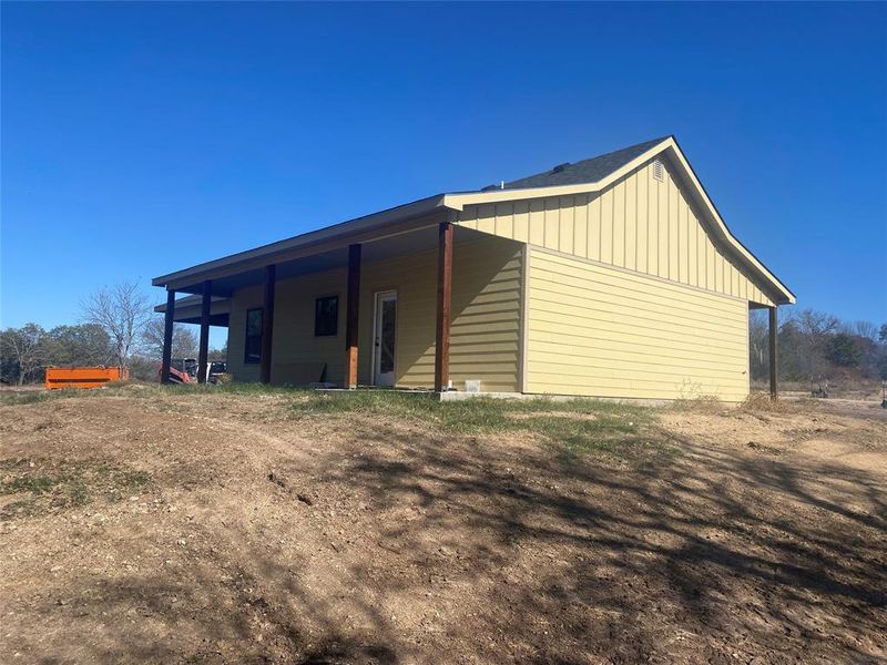 View of property exterior with board and batten siding