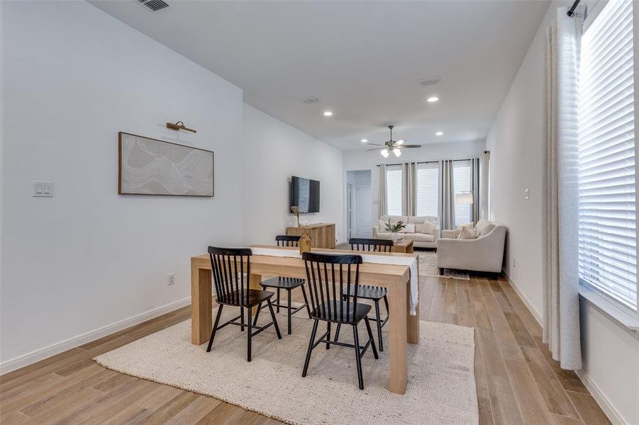 Dining room featuring light wood-style flooring, recessed lighting, and a ceiling fan