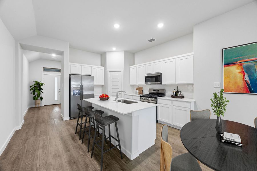 Kitchen in the Cedar home plan by Trophy Signature Homes – REPRESENTATIVE PHOTO
