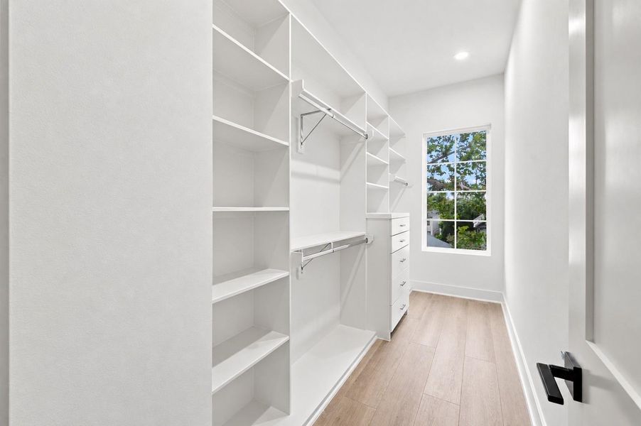 One of two primary closets.