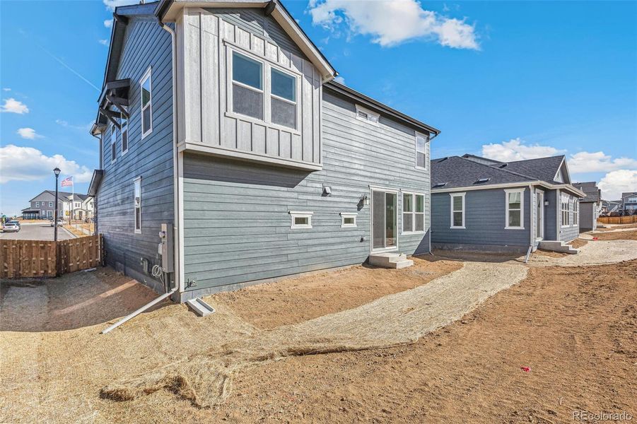 Front exterior of a new home in Turnberry, Commerce City, CO, highlighting curb appeal (Image 21).
