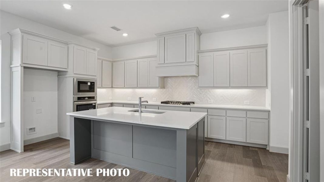 Gorgeous counter tops, beautiful cabinetry, wonderful flooring and stainless steel appliances come together to create the kitchen of your dreams!  REPRESENTATIVE PHOTO