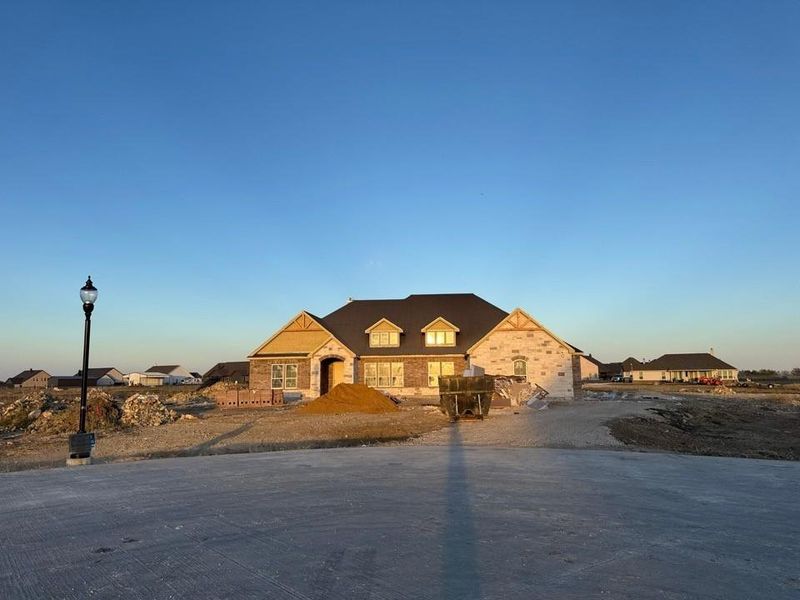 Front exterior of a new home in Rocky Top, Krum, TX, highlighting curb appeal (Image 1). Front exterior of a new home in Rocky Top, Krum, TX, highlighting curb appeal (Image 1).