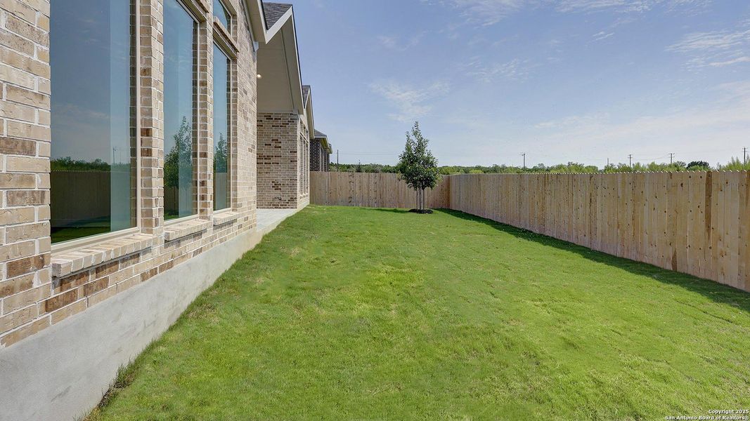 Front exterior of a new home in Kallison Ranch 60', San Antonio, TX, highlighting curb appeal (Image 20).