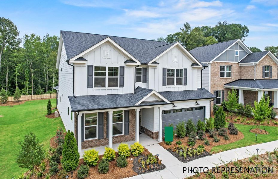 Front exterior of a new home in Forest Creek, Waxhaw, NC, highlighting curb appeal (Image 1). Front exterior of a new home in Forest Creek, Waxhaw, NC, highlighting curb appeal (Image 1).