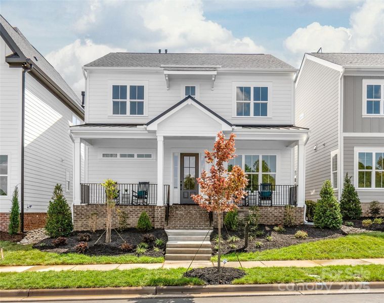 Front exterior of a new home in , Davidson, NC, highlighting curb appeal (Image 2).
