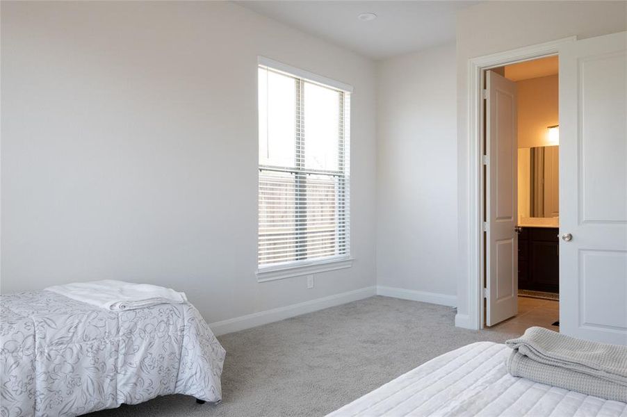 Secondary bedroom with full bathroom downstairs