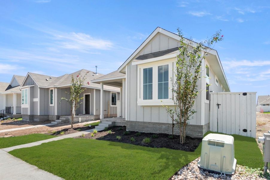 Front exterior of a new home in Casetta Ranch, Kyle, TX, highlighting curb appeal (Image 21).
