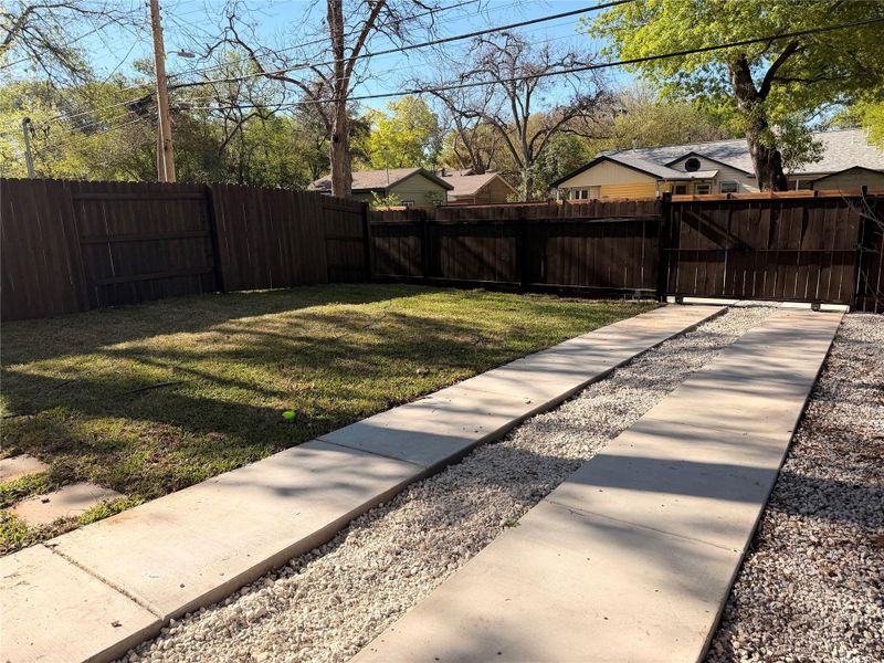 Fenced backyard with a gate