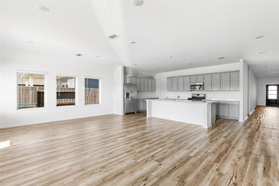 View from the family room/dining area combo. Holidays, birthdays and special events will be hosted here! That additional counter top space and cabinets next to the refrigerator looks like a buffet line to me! View from the family room/dining area combo. Holidays, birthdays and special events will be hosted here! That additional counter top space and cabinets next to the refrigerator looks like a buffet line to me!