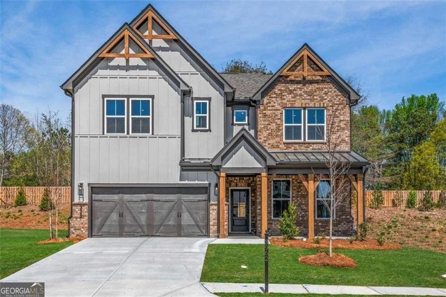 Front exterior of a new home in The Paddocks at Doc Hughes, Buford, GA, highlighting curb appeal (Image 1). Front exterior of a new home in The Paddocks at Doc Hughes, Buford, GA, highlighting curb appeal (Image 1).