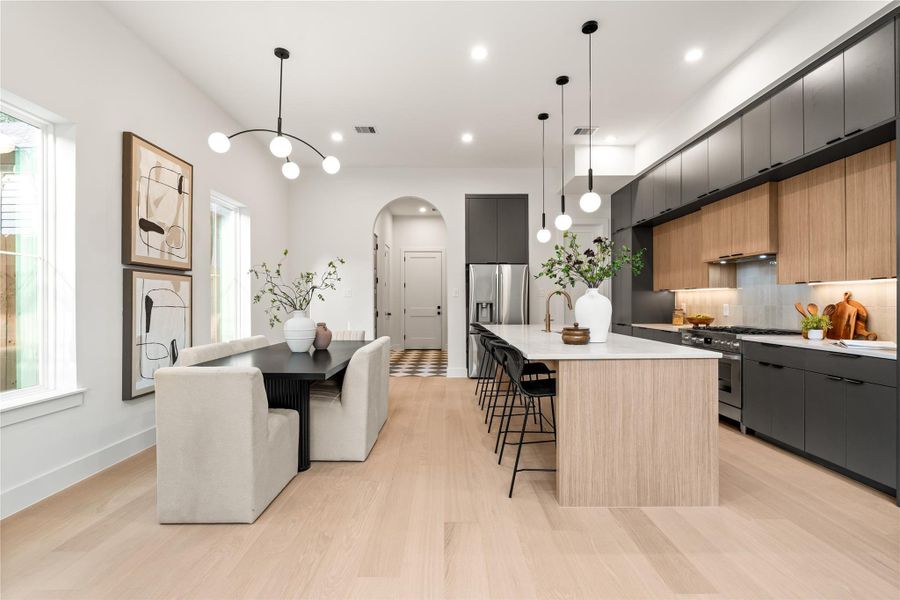 This oversized kitchen features luxury Bosch appliances, Taj Mahal counters, and more than enough storage space with three layers of European soft close cabinetry. This oversized kitchen features luxury Bosch appliances, Taj Mahal counters, and more than enough storage space with three layers of European soft close cabinetry.