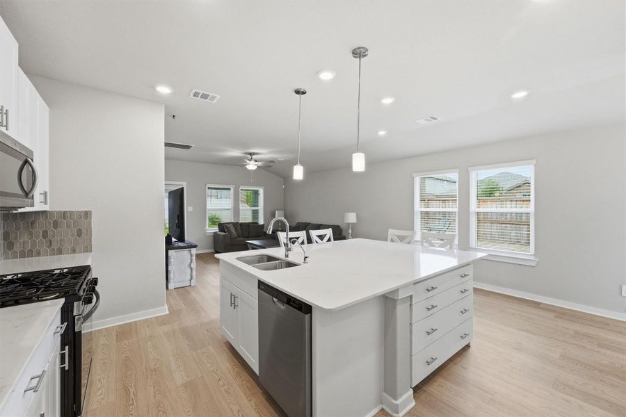 View of the windows replaced by the seller with functional windows that open! Pendant lighting over the generously sized Island. Gather in the kitchen with plenty of counter space to prepare and enjoy meals together. View of the windows replaced by the seller with functional windows that open! Pendant lighting over the generously sized Island. Gather in the kitchen with plenty of counter space to prepare and enjoy meals together.