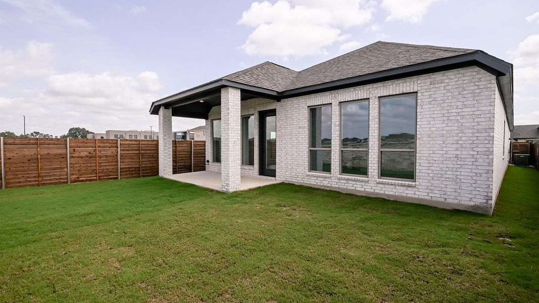 Exterior details and patio area of a home in Juniper Springs, Lockhart (Image 2).