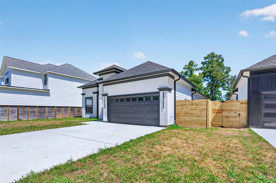 Front exterior of a new home in , Conroe, TX, highlighting curb appeal (Image 26).