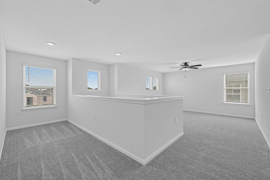 Representative unfurnished interior of a home built from the Warbler by Taylor Morrison in Longview, Del Valle (Image 10).