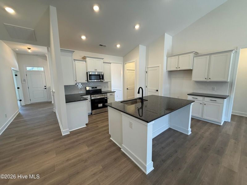Furnished interior view inside a new home in Wood Creek Landing, Leland (Image 6).
