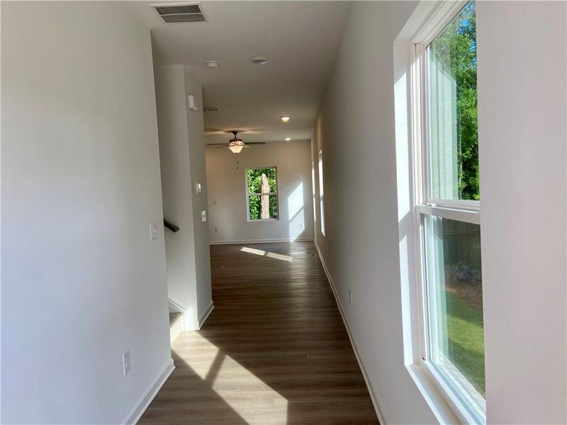 Spacious, unfurnished interior of a new home in Eastlyn Crossing, Flowery Branch (Image 10).