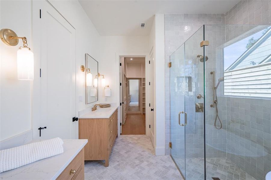 Bathroom featuring herringbone vanity and walk in shower